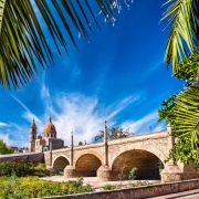 Old colonial bridge and Parish of the Light in Lagos de Moreno